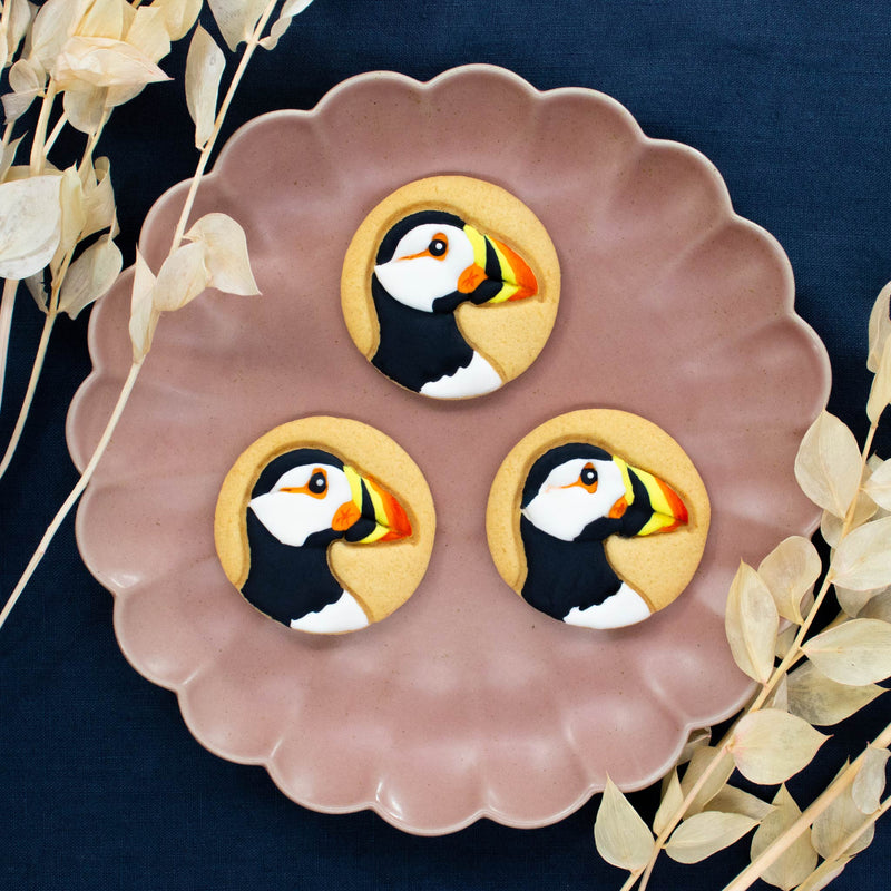 BAKERLOGY Puffin cookies colored with royal icing