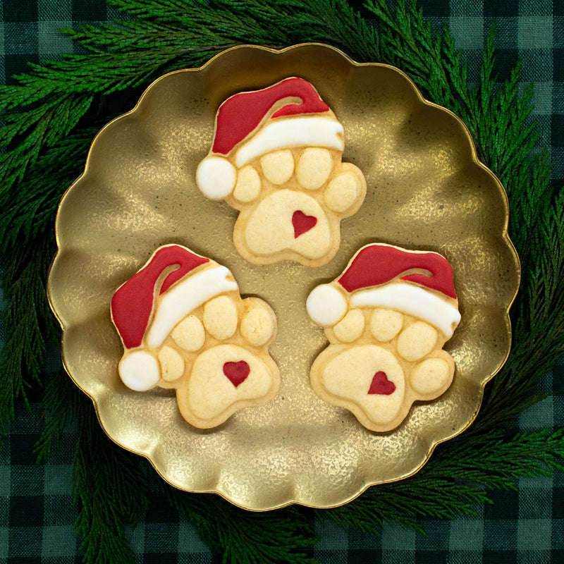 bakerlogy santa paw cute sugar cookies colored with royal icing