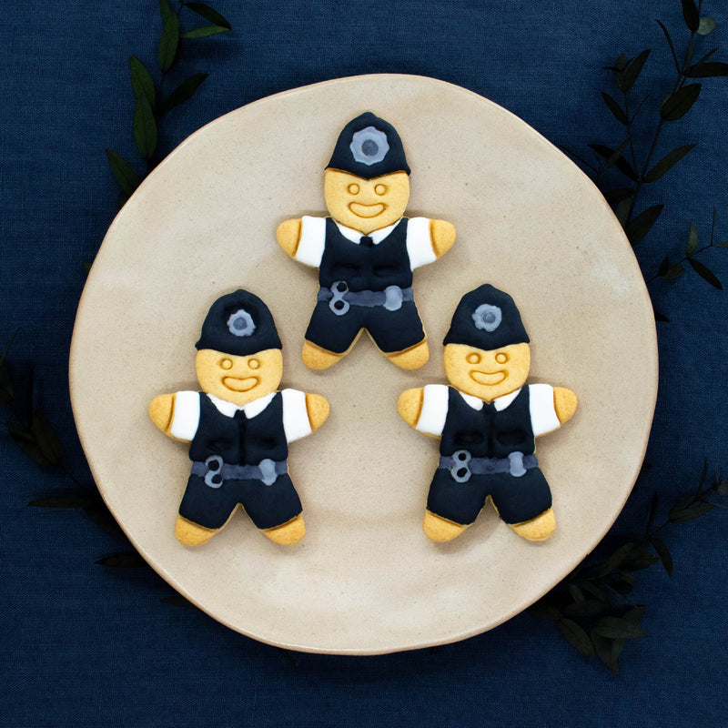 UK Police Bobby cookies colored with royal icing made with bakerlogy UK police constable cookie cutter