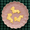 bakerlogy christmas dachshund sugar cookies on a plate