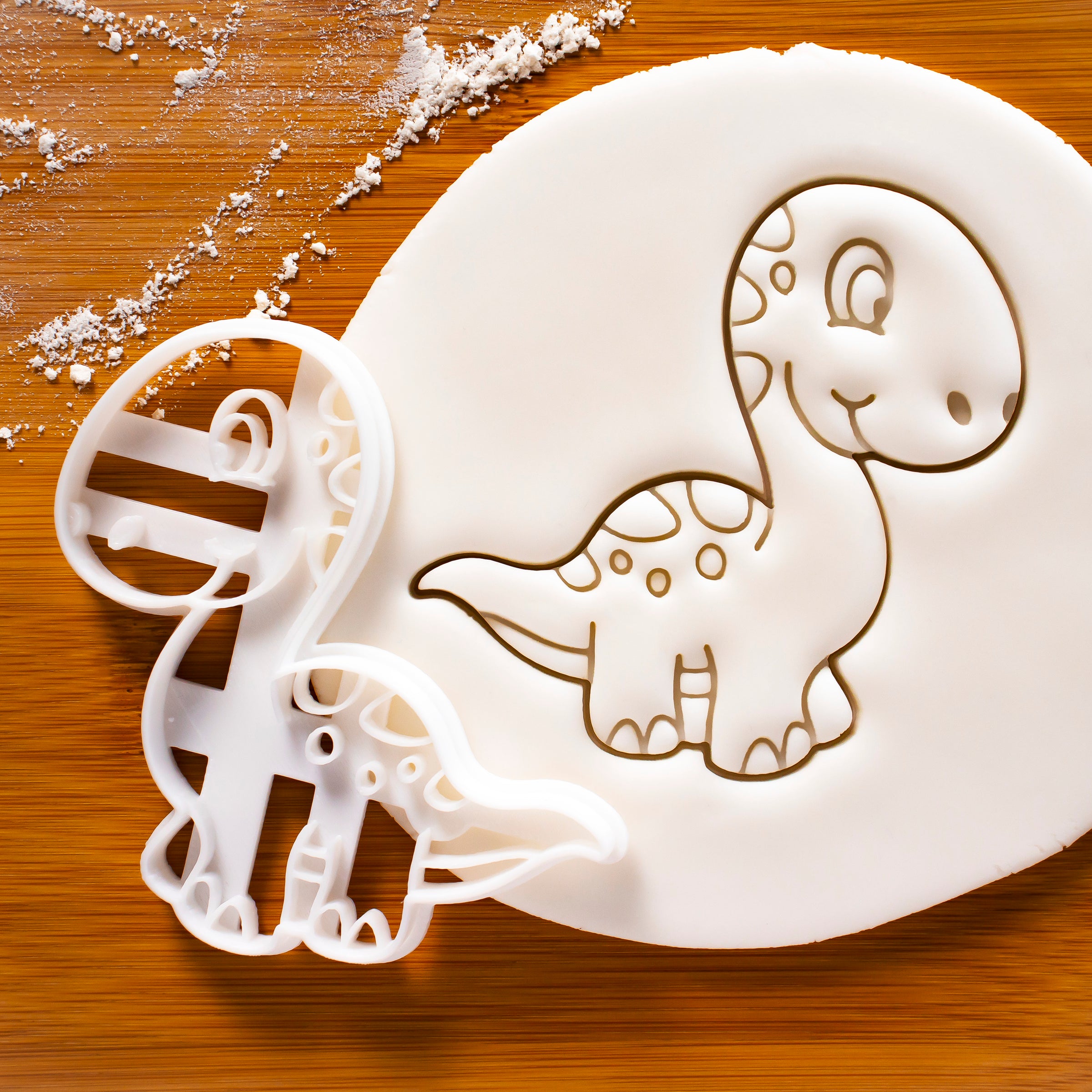 Baby Brachiosaurus dinosaur cookie cutter pressed on fondant