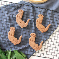 swimming sea otter cookies