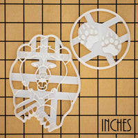 set of 2 cookie cutters, featuring a bear, and a bear's paw prints