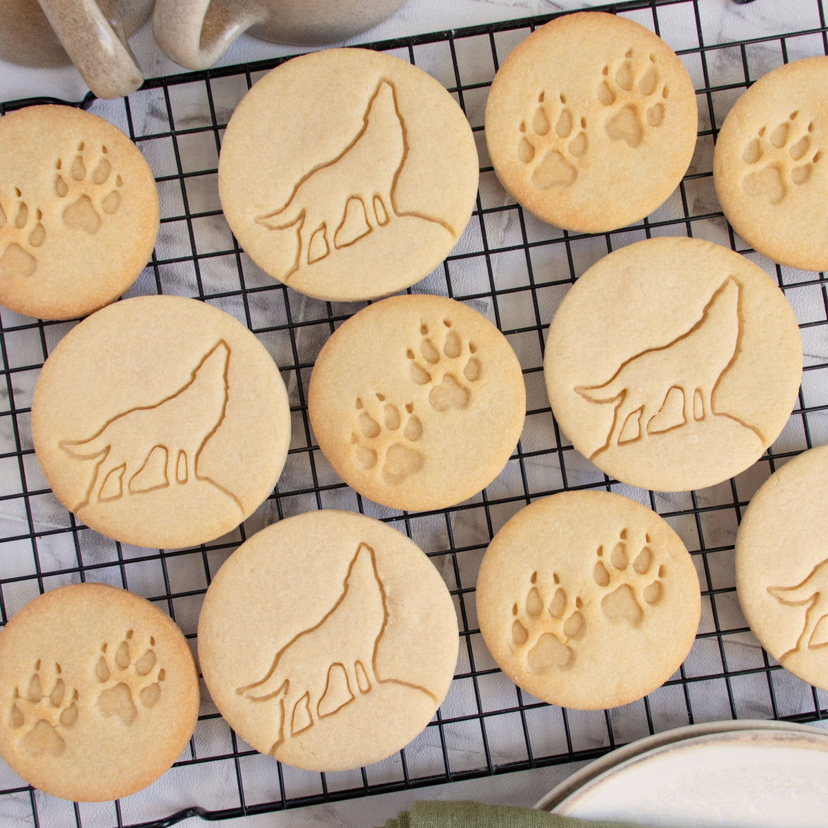 howling wolf and wolf paw prints cookies