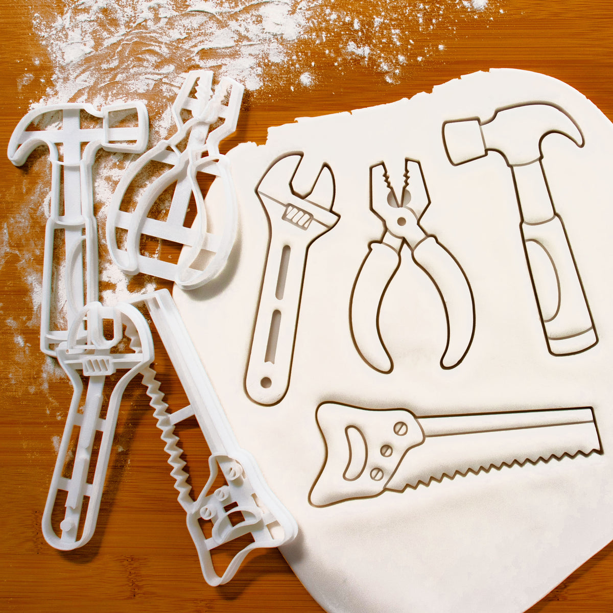 set of 4 hand tools cookie cutters, featuring a hammer, a hand saw, a wrench and a pair of pliers