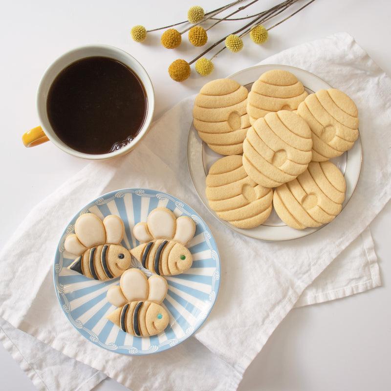 set of cute bee and honey beehive cookies