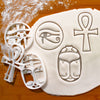 set of 3 cookie cutters, featuring an ankh, eye of horus and scarab beetle.