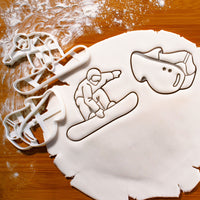 set of 2 snowboarding cookie cutters, featuring a snowboarder and a snowboard goggles