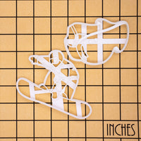 set of 2 snowboarding cookie cutters, featuring a snowboarder and a snowboard goggles