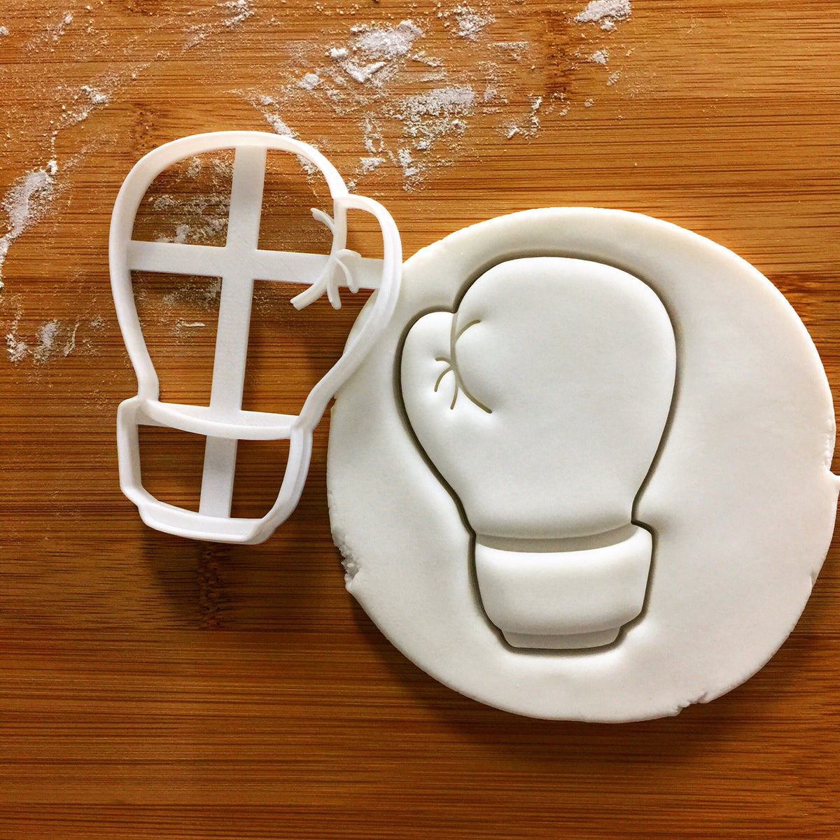 boxing glove cookie cutter (back view) pressed on fondant