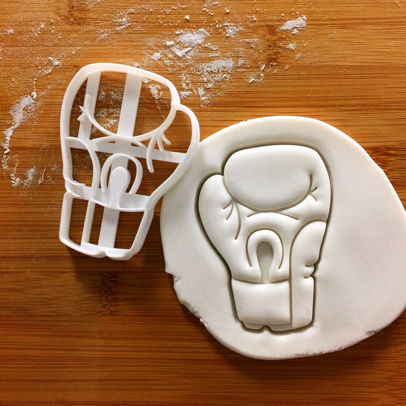 boxing glove cookie cutter (palm view) pressed on fondant