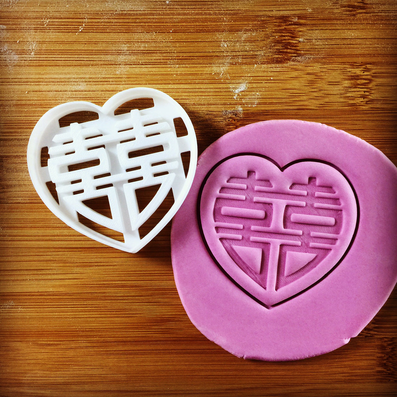 Chinese Wedding Cookie Cutter (Heart Outline) pressed on fondant