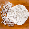 set of 4 cookie cutters, featuring a happy gingerbread man, a zombie gingerbread man, a vitruvian gingerbread man and a voodoo gingerbread man