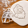 santa claus face cookie cutter pressed on white fondant