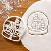 snow globe cookie cutter pressed on white fondant