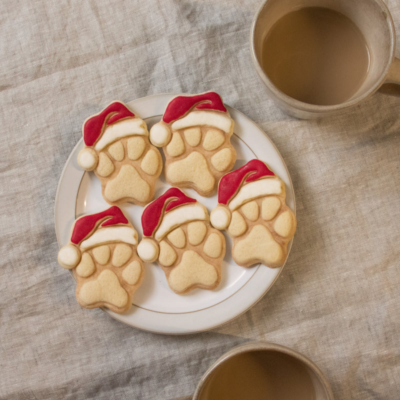 realistic christmas hat santa paw cookies