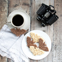 flying bat cookies on a plate