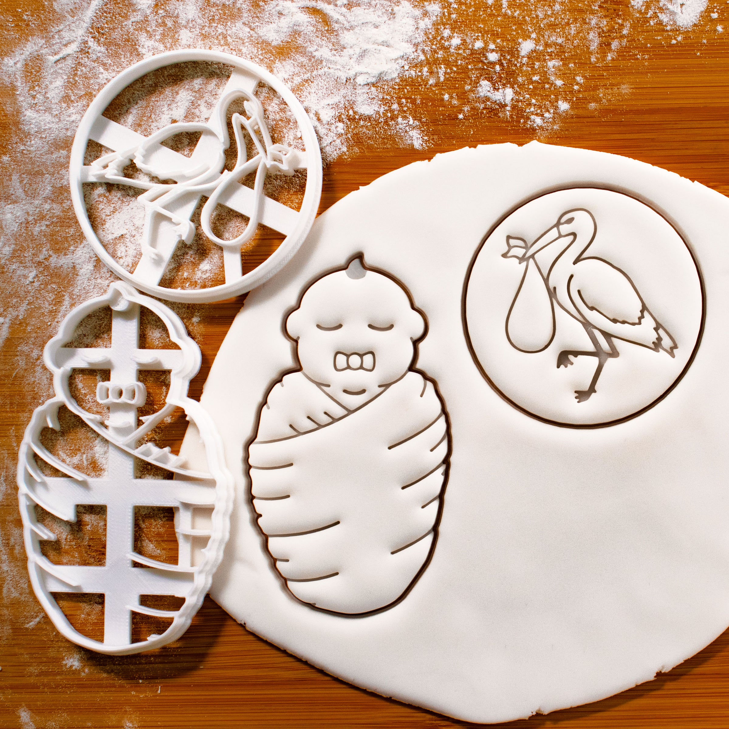 swaddled baby and stork with baby cookie cutters